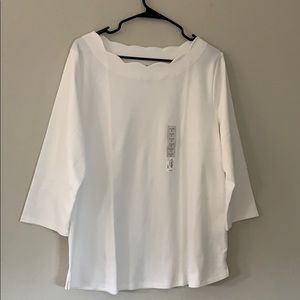 A plain white medium sleeve shirt & wavy neckline